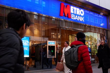 People walk past a branch of Metro Bank in Manchester.