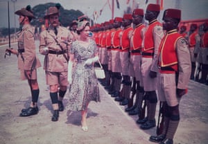 1954: Queen Elizabeth II inspecting a line of troops during her six-month world tour of the Commonwealth, where she visited 13 countries by land, sea and air