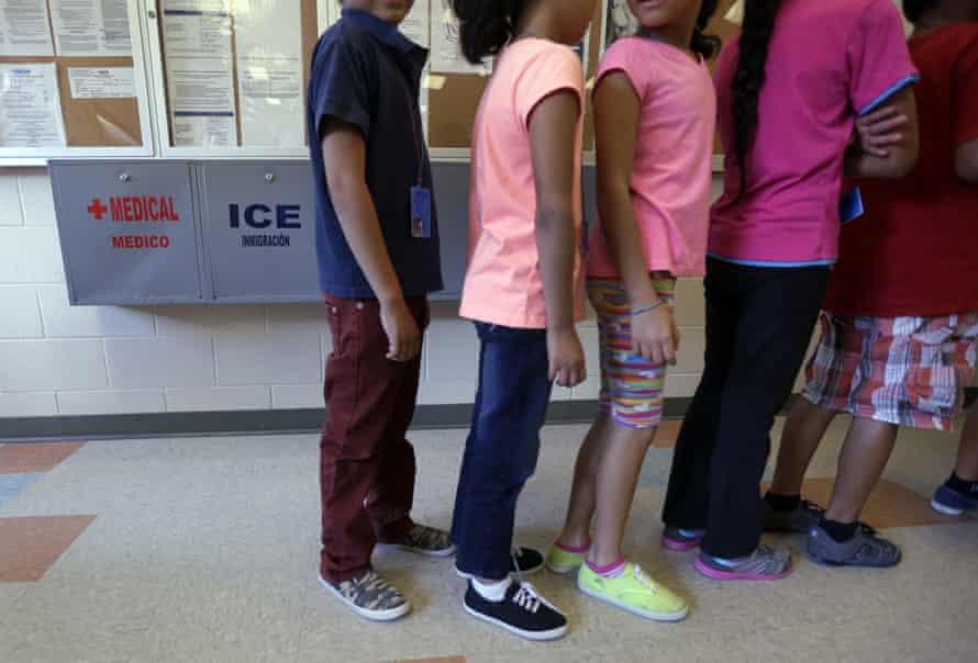 Children line up in the cafeteria at the Karnes center.