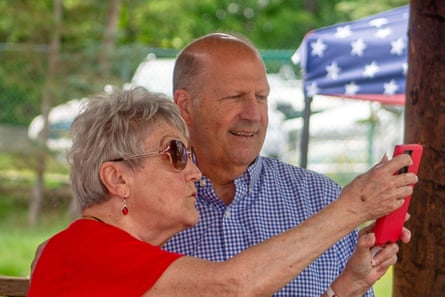 a woman takes a selfie with a man a woman takes a selfie with a man