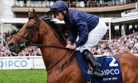 The racehorse City Of Troy being ridden by jockey Ryan Moore at Newmarket.