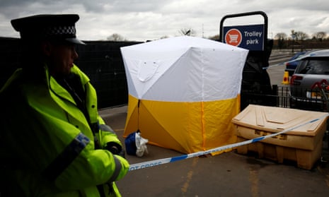 A police officer stands at a cordon placed around a payment machine covered by a tent in a supermarket car park near to where former Russian intelligence agent Sergei Skripal and his daughter Yulia were found poisoned in Salisbury