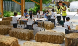 Are you sitting comfortably? … schoolkids on the straw bales.