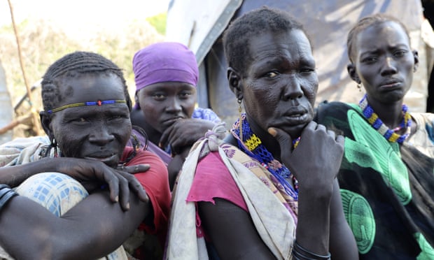 Kallayn Keneng, right in the foreground, sits with other women in Lekuangole, South Sudan. All the women have lost children after they were displaced by fighting.