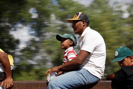 A father and son together on a freight train in Hidalgo state, 14 April