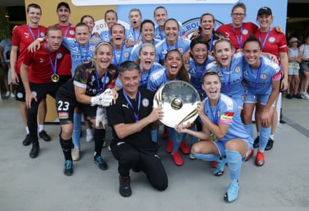 Rado Vidosic and Stephanie Catley hold the A-League Women premiers plate as Melbourne City celebrate their league win