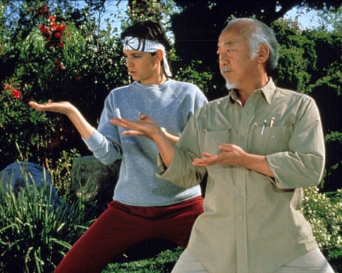 Macchio with Pat Morita as Mr Miyagi in The Karate Kid (1984).