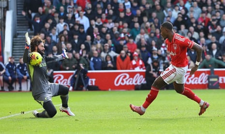 Alisson makes a smart save from Callum Hudson-Odoi.