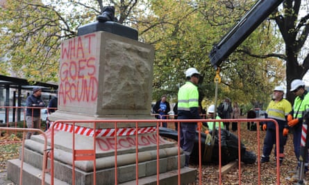 Council workers remove the statue of former Tasmanian premier William Crowther after it was cut down by vandals at Franklin Square in Hobart, Wednesday, May 15, 2024.