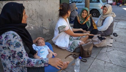 Homeless refugees in Victoria Square, Athens, with MSF health worker