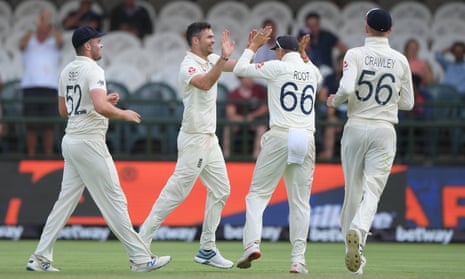 England bowler James Anderson is congratulated by team mates after taking Hamza’s wicket.