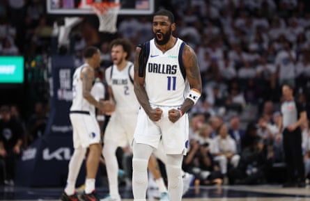Mavericks guard Kyrie Irving (11) celebrates during the fourth quarter against the Timberwolves in Thursday’s Game 5 of the West finals.