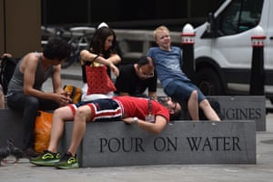 People resting in the heat in London, July 2019