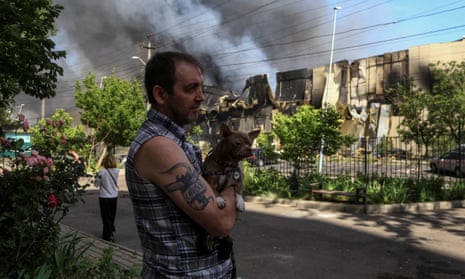 A local resident stands at a site of a Russian missile strike in Odesa, Ukraine.