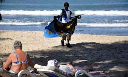 Vendor working on a beach in Gambia.