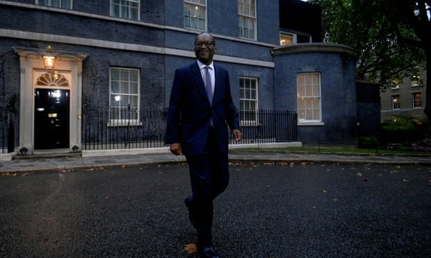 Kwasi Kwarteng walks outside Number 10 Downing Street.