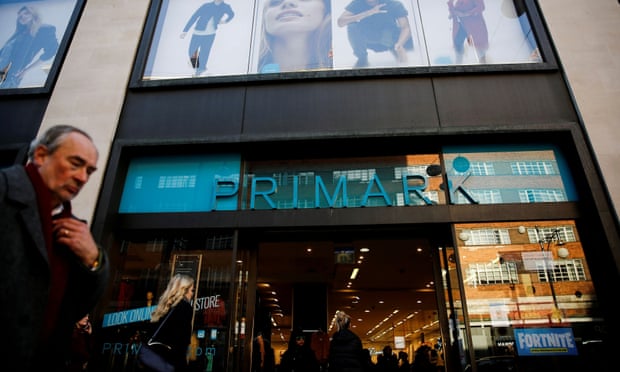 Shoppers walk past a Primark store on Oxford Street in London