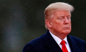 Donald Trump closes his eyes as he visits the American Cemetery of Suresnes
