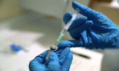 A needle is filled from a phial of Pfizer/BioNTech Covid-19 vaccine.