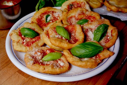 Rachel Roddy’s little fried pizzas are topped with a blob of tomato sauce, grated parmesan or pecorino and a basil leaf.
