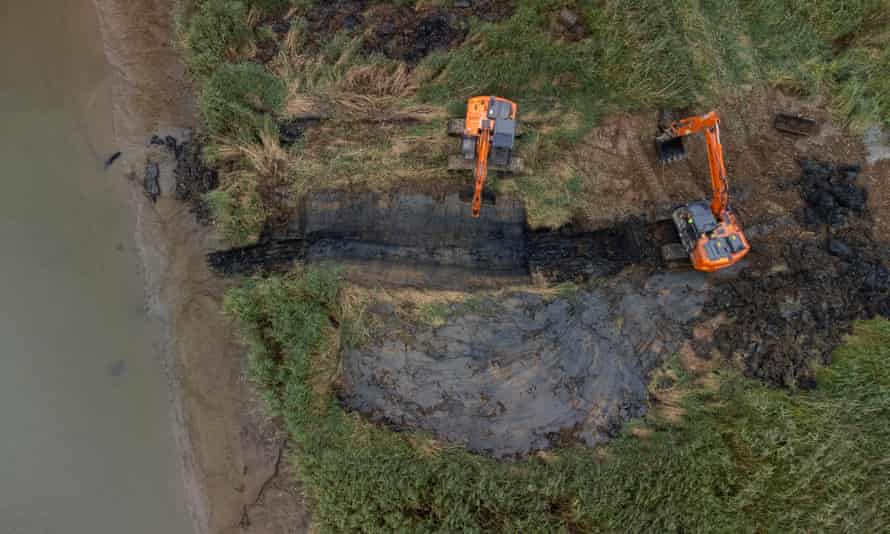 Work to create a breach in the bank at Cotehele.