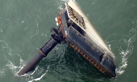 In this 18 April 2021 photo, the capsized lift boat Seacor Power is seen seven miles off the coast of Louisiana in the Gulf of Mexico. 