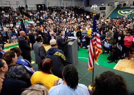 Abdul El-Sayed speaks at a podium before a large crowd at a labour rally