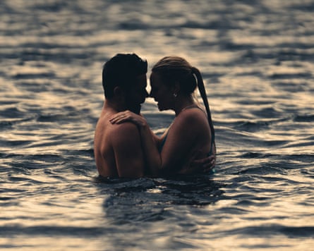 Beth (Romola Garai) and Tom (Dominic Cooper) in a lake together.