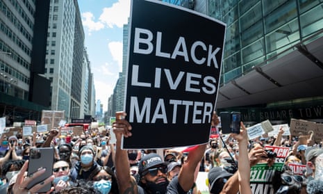 A man holds up a ‘Black Lives Matter’ sign during a demonstration in New York City on 7 June 2020. 