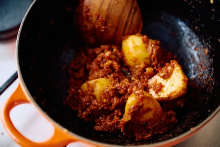 Close up of an egg and potato curry dish.
