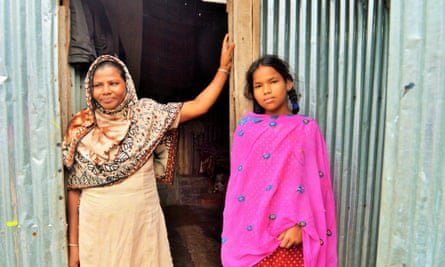 Parul Akter and her daughter in Dhaka’s Korail slum.