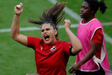 Ilona Maher of USA tries to whip up the crowd as she heads back to the changing room after warming up.