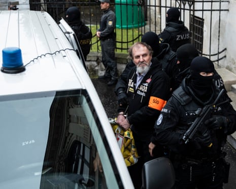 Juraj Cintula, the man accused of shooting the Slovak prime minister, is escorted by police after the main trial over the assassination attempt at the Specialised Criminal Court in Banska Bystrica, Slovakia, 21 October 2025.