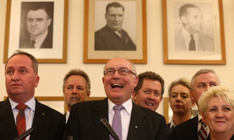 Nationals leader Warren Truss flanked by MPs in their party room