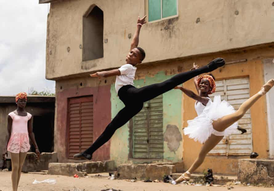 Anthony Madu leaps on a street on the outskirts of Lagos