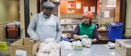 Lawrence, right, and Haydeth Tavera, left, distribute chickens at the West Side Campaign Against Hunger on Monday morning. Tavern has worked for the organization for 11 years: five as a volunteer and six as a staff member, after being a dependent on food from West Side Campaign Against Hunger herself.