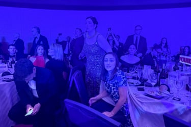 Guests watch from tables after US President Donald Trump and first lady Melania Trump were rushed out of the White House Correspondents’ Association dinner