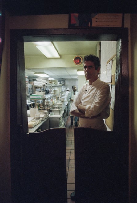 A chef in the shadow of the door