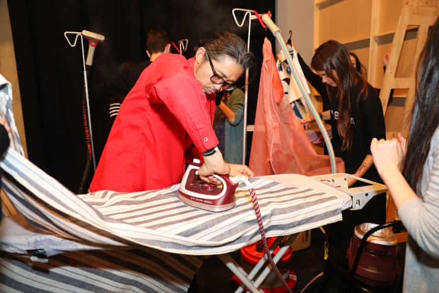 Akira Isogawa ironing clothes backstage at his show, Arika, at fashion week.