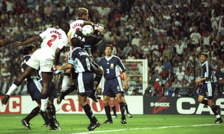 Sol Campbell (left) of England rises to head the ball into the back of the Argentina net, but the goal is disallowed for Alan Shearer’s elbow on goalkeeper Carlos Roa.