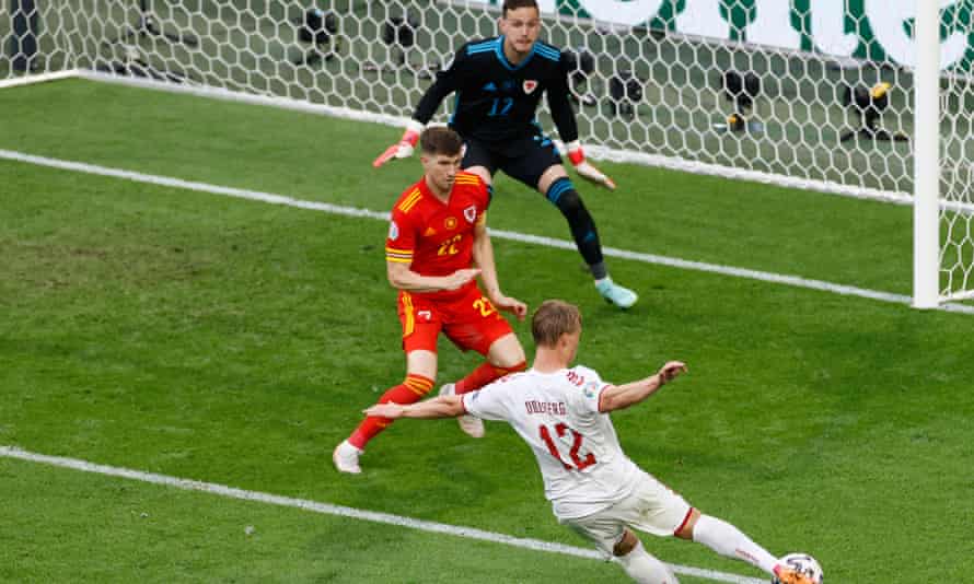 Denmark end Wales’ Euro 2020 dreams as Dolberg double caps dominant win | Euro 2020 1 Denmark’s Kasper Dolberg fires in his second goal against Wales.