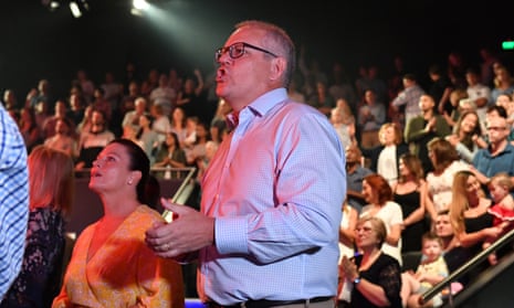 Australian prime minister Scott Morrison and wife Jenny sing during a service at Horizon church at Sutherland in Sydney, Australia