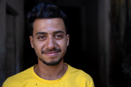 Portrait of a young man wearing a yellow T-shirt