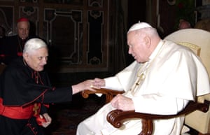 Cardinal Ratzinger greets Pope John Paul II during a meeting in the Vatican in 2005.