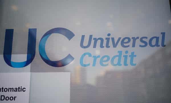 A universal credit sign on the door of a job plus center