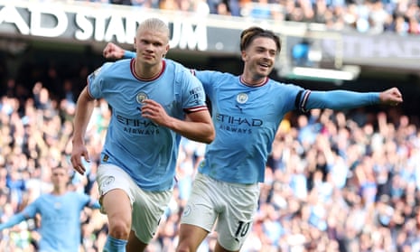 Manchester City's Erling Haaland celebrates scoring their fifth goal with Jack Grealish and completing his hat-trick