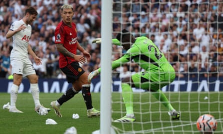 Manchester United’s Lisandro Martínez watches as his deflection takes the ball past André Onana and into his own net.