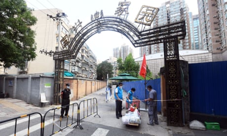 Volunteers deliver necessities ordered by residents in quarantine in Haidian district, Beijing