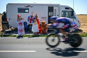Team Picnic PostNL team’s Pavel Bittner cycles past patriotically dressed Great Britain spectators.