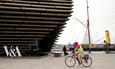 A cyclist passes V&A Dundee